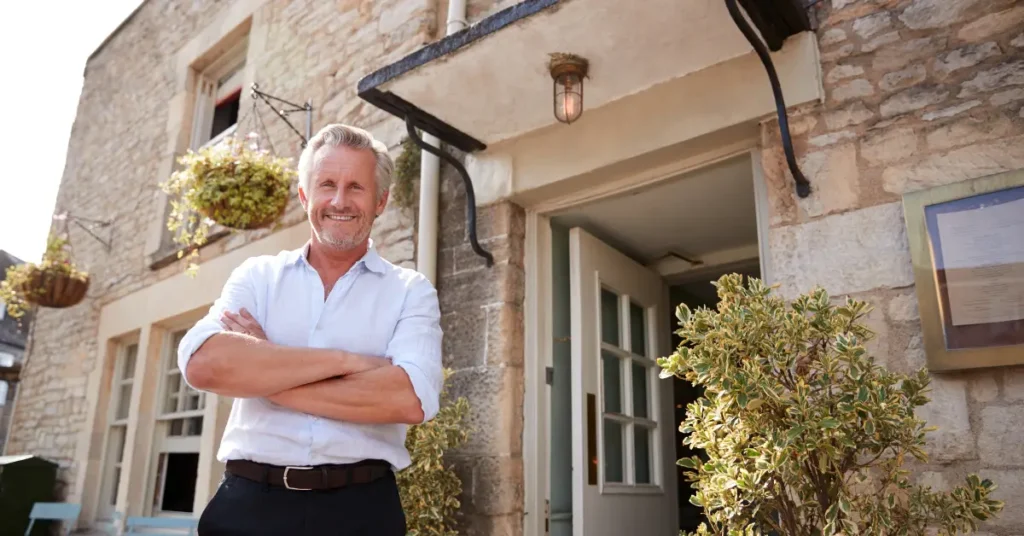 a man standing outside a house